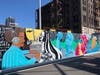 A new mural honors late El Puente founder Luis Garden Acosta.