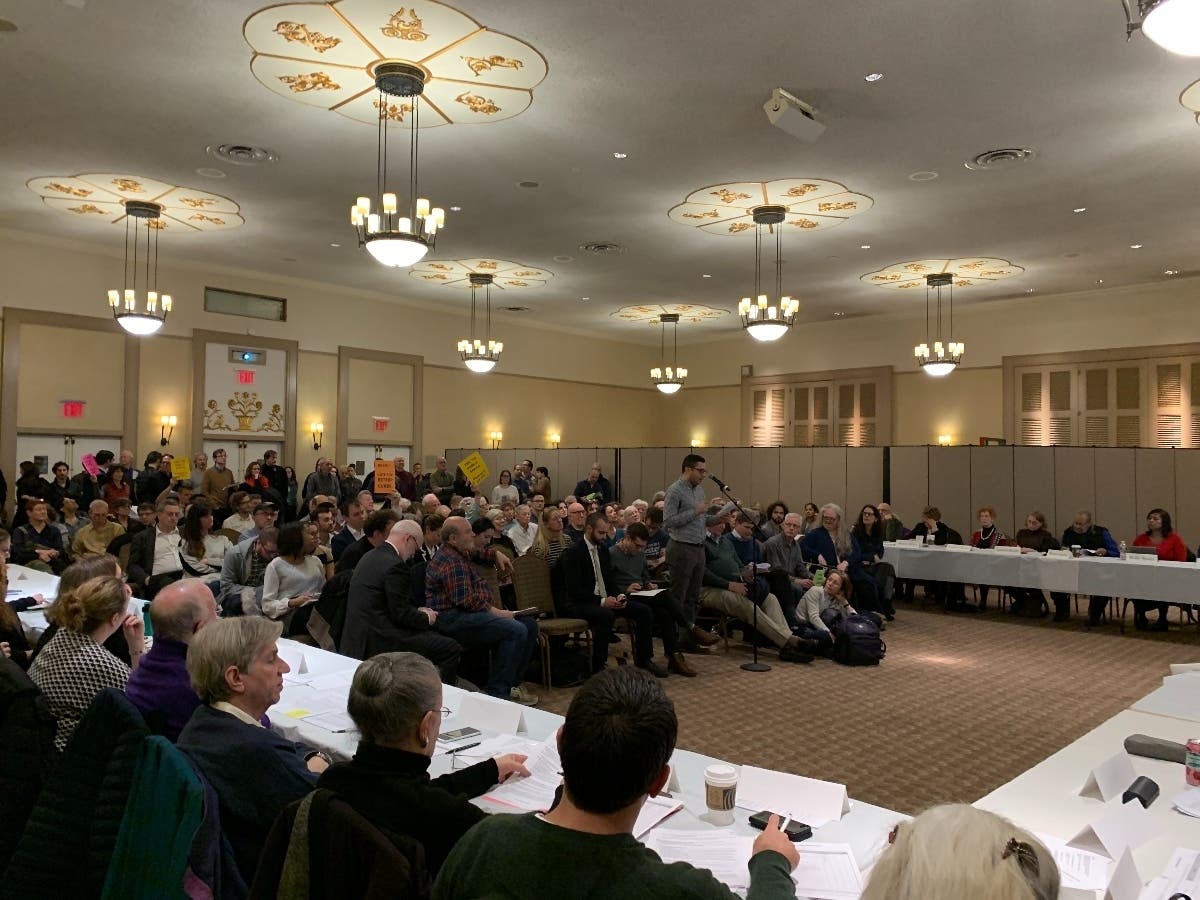 A request to study "curbside use" that has gone back and forth for months passed the community board after hours of still-divided testimony.