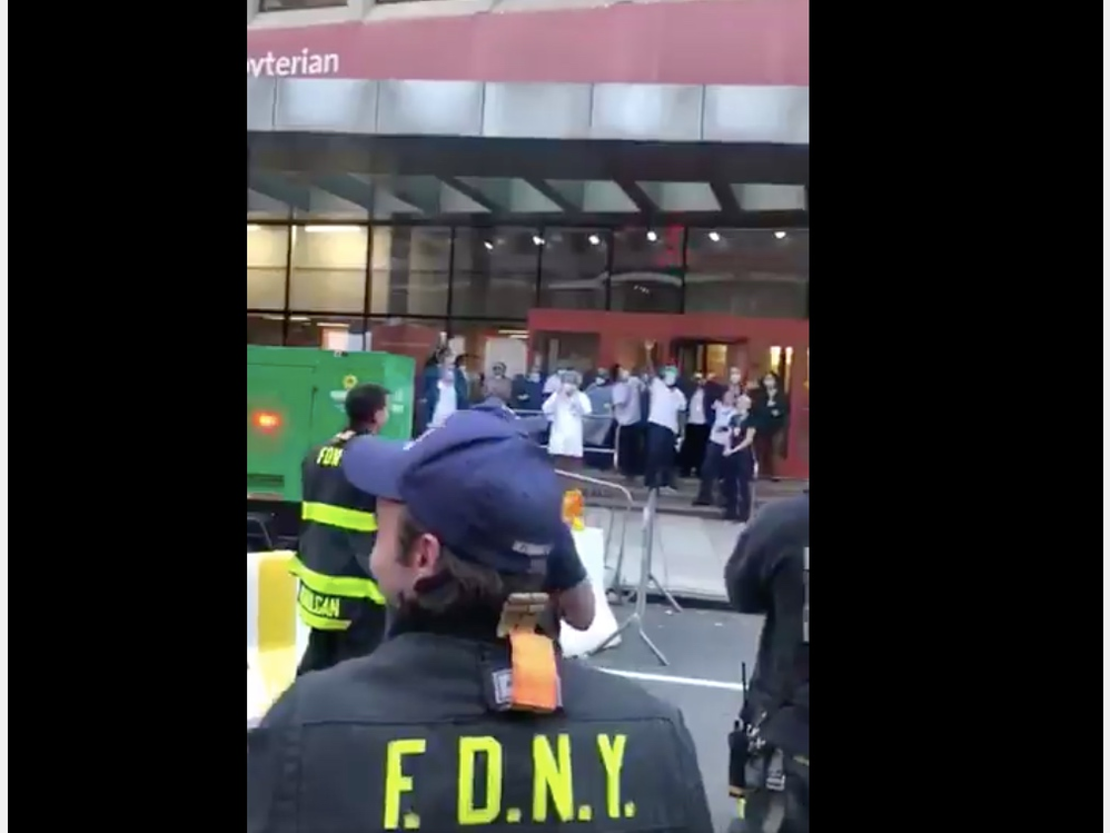 Hospital staff leaving work in Morningside Heights and Lower Manhattan were greeted by a line of firefighters cheering for them, video shows