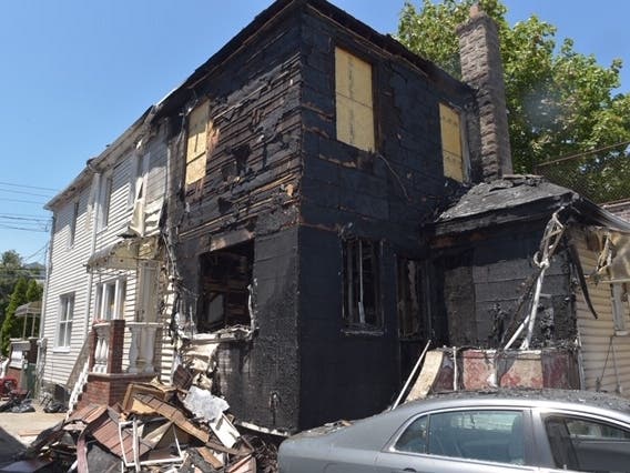Damien Bend only noticed fireworks lit in the driveway started a fire when he went back in the East 51st Street home to get more, FDNY said.