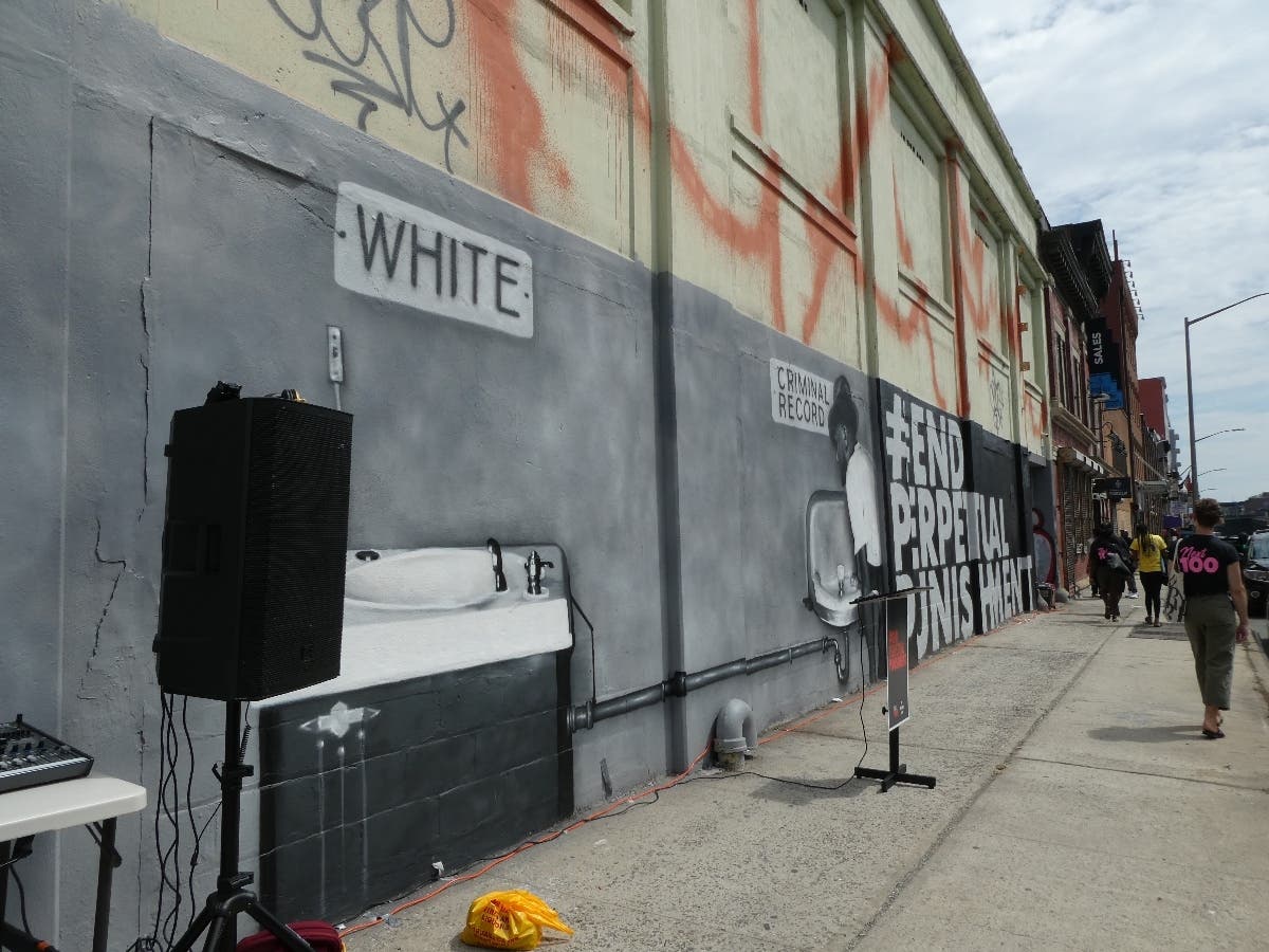 A new mural on Atlantic Avenue is part of a Bed-Stuy native's campaign about the "perpetual punishment" of living with a criminal record.