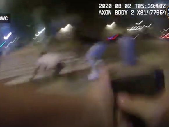 The NYPD released body camera footage Thursday of the moment an officer shot at a man who had a gun pointed at her on a street in Bed-Stuy.
