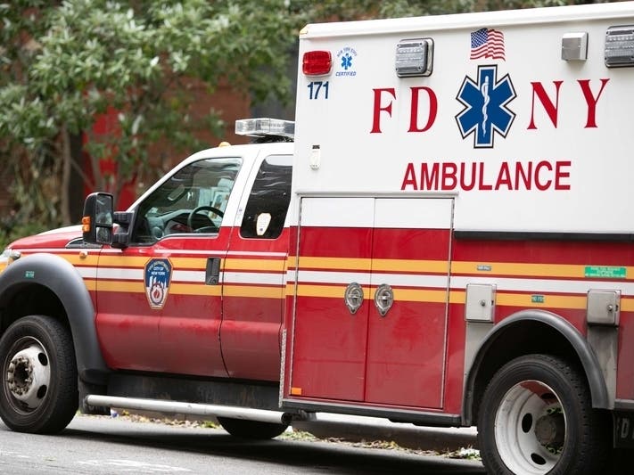 A firefighter was sent to the hospital after a fire on Monroe Street spread to the neighboring buildings, fire officials said.