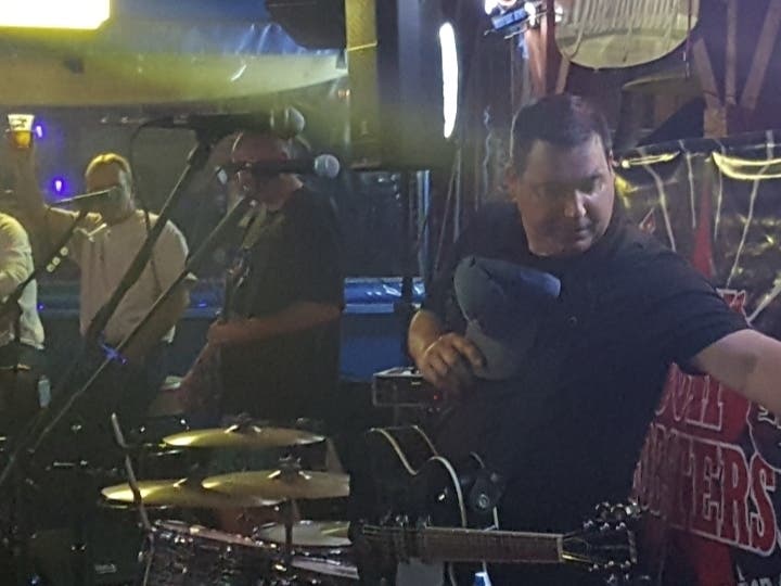 The Rock Lobsters take a break to perform our National Anthem on guitar.