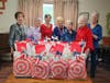 Caroline Triano, Pat Clarke, Pat Henry, Bobbie Frederickson, Johanna Rysz, Linda Petsch and Josie Steenburgh (left to right) put together packages for veterans at Mt. Zion.