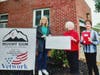 Linda Petsch and Caroline Triano present Maddie Stapleton (far left) with check for Mt. Zion.