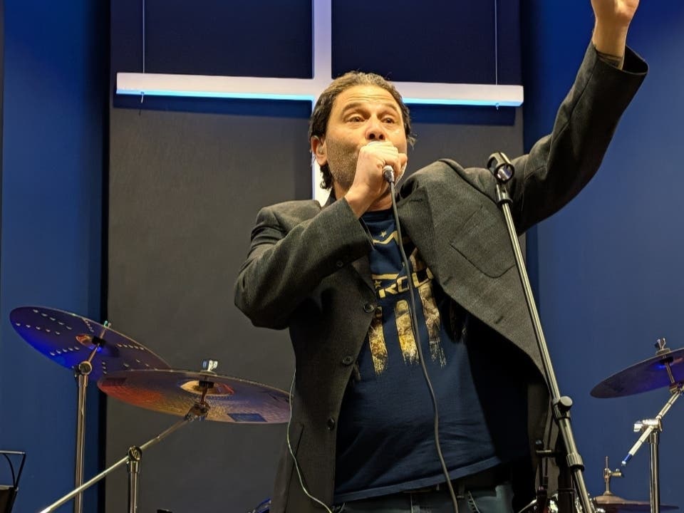 George Saccal sings words of praise to Jesus at a previous event.