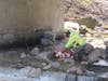 Workers remove a barrier at Mill Creek near the Cal-Sag Channel