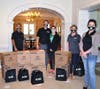 IBC Presidents Jerry Vinci and Nathan Karaway personally donate masks to King-Bruwaert House, with IBC Marketing Manager Lori Beth Irvin and Southfield Corporation Safety Manager Dina Guzman.