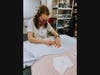 Allison Zink, a postulant with the Apostles of the Sacred Heart of Jesus, prepares fabric for cloth masks