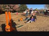 Father / Daughter putting in a full effort at the slingshot
