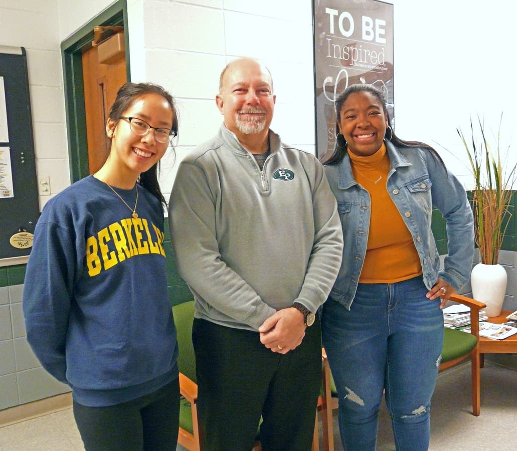 Kayla and Imani are pictured here with Principal Sanderson.