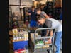 Church youth group unloads over 1500 boxes and cans of food for local food bank.
