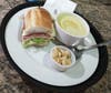 The menu at Grinders features 13 sandwiches, all featuring Boar's Head meats and cheeses on freshly baked bread. Salad versions also are available, and a half-sandwich, cup-o'-soup combo is just $6.95.