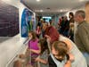 Visitors take in the learning center at Jurassic Gardens during a recent preview tour of the new attraction at the Volo Auto Museum on Volo Village Road.