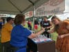 Guests purchase beer and wine tickets at a past Blues, Brews & BBQ at Petersen Park in McHenry. This year's event is Aug. 20-22. Blues, Brews & BBQ raises funds for the McHenry Area Rotary, which distributes proceeds to numerous charities.