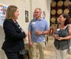 Visit McHenry County Executive Director Jaki Berggren, left, talks with Cort Carlson, the tourism agency's first executive director, and Carlson's wife, Jamie, during a 16th anniversary celebration this summer.
