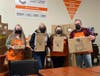 Shown with some of the $5,700 in toys and delivery supplies Home Depot donated to Rotary Secret Santa this year are (from left) Venus Obara, honorary McHenry Area Rotarian Cynthia Wolf, Store Manager Geri Quirk-Blanken and Donnie Hallin.