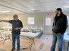 Marketing Director Jim Wojdyla (right) laughs as Volo Museum Director Brian Grams  recalls childhood memories of a space being transformed into a Party Barn. A $695 party package will be awarded to the winner of a Jan. 23-30 online contest. 