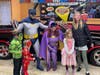 Costumers With a Cause and Volo Museum visitors enjoy a photo opp in front of the Batmobile during a previous Princess and Superhero Day. This year's event takes place March 25.