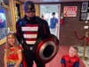 A cosplayer dressed similarly to Capt. America greets a young Wonder Woman and Spiderman during a previous Princess and Superhero Day at the Volo Museum. This year, the event takes place March 25.