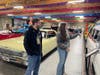 Guides Seamus Pearcy and Jordan Burg pause by the Volo Museum's Ecto-1 during a guided tour. Offering insider lore and behind-the-scenes access, tours are now available Tuesdays and Thursdays, included with museum admission. 