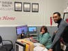 Dawn Bremer, owner and president of the Bremer Team – Keller Williams Success Realty, and U.S. Marine veteran Michael Adams, a member of the Bremer Team, take a break to talk about the team's newly launched Heroes Savings Plan.