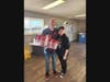 McHenry Outdoor Theater owner Scott Dehn holds packages of diapers donated by Kimberly (also pictured) and Jeremy Miller of Elgin. A diaper drive takes place at the theater starting at 6 p.m. Sunday, May 19. Donors may stay for a free movie.