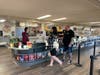 Moviegoers approach cashier Savannah Heidler at the fully renovated Bremer Team Taphouse and Snack Bar at the McHenry Outdoor Theater, open seven days a week starting May 24.
