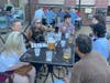 Friends (clockwise from left) Felicity and Ken Gorham, Marlee and Nick Buenrrostro, Kevin Drake, Chris Bomba and Darrick Roy, all of Palatine, agree on an answer during Pub Trivia on the rooftop at Durty Nellie's on a recent Wednesday.