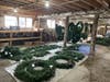 Wreaths and greens are stored in the 1890s-circa former dairy barn at the Richardson Christmas Tree Farm in Spring Grove.