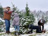 Family members cut down their selected tree during the 2023 holiday season at Richardson Christmas Tree Farm, 9407 Richardson Road, Spring Grove. The farm opens this year on Friday, Nov. 29, and will remain open daily until Sunday, Dec. 22.