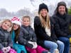 A family enjoys a wagon ride back to the gift barn after selecting their favorite tree during the 2023 holiday season at Richardson Christmas Tree Farm in Spring Grove. Free wagon rides are available on weekends to and from the fields.