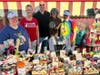 McHenry Outdoor Theater owner Scott Dehn welcomes representatives of the Animal Outreach Humane Society of McHenry County during a Project Popcorn night at the theater. The fundraising program is ongoing Wednesdays through Aug. 5.
