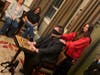 Audience member Mercedes Matthews concentrates on her chosen historical figure as Midwest Mystic Joe Diamond employs a Ouija board to determine who it is during a recent show at the Grand Victorian of Crystal Lake.
