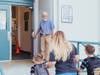Teacher Dave Larson welcomes parents and students on opening day at Central Elementary School.