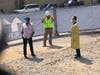A worker (L), foreman on his cell phone (C), and Rabbi Shmuel Herzfeld of Ohev Sholom (R)