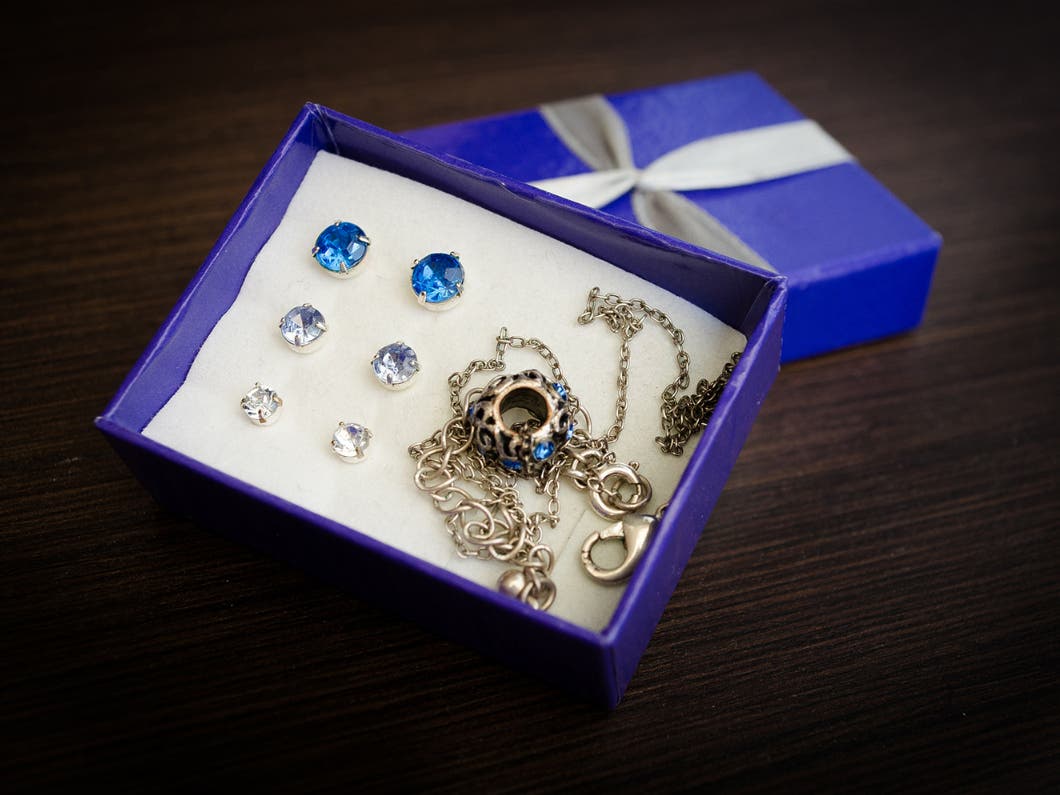 blue box with earrings inside