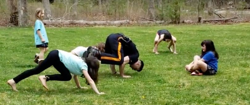Four EHT officers enjoyed some lemonade from local girls. A couple showed off their yoga and cheerleading skills.