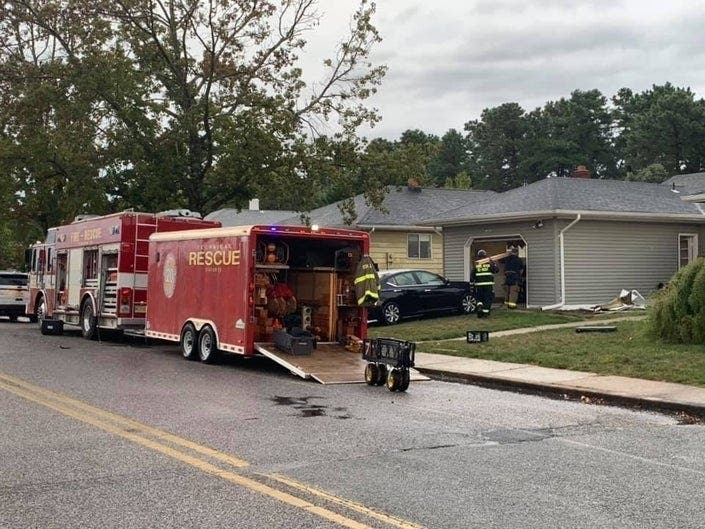 A two-car crash sent a vehicle through a Berkeley home, injuring a man on the couch, police said.