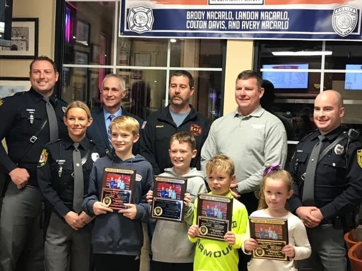 Four Manahawkin kids saw a house fire and called 911 quickly to prevent it from spreading.