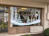 Heather Henry created seasonal paintings on the windows of three Ocean City businesses: JiLLy's Arcade, Avalon Flooring and Impala Island Inn.