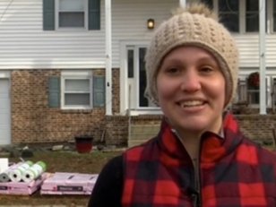 Action Creations Roofing & Siding surprised Ocean City 911 dispatcher Amber Adoranto with a free roof repair and gifts for her children.