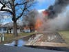 A woman suffered burns and was airlifted during a Pine Beach house fire, officials said.