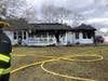 A woman suffered burns and was airlifted during a Pine Beach house fire, officials said.