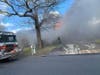 A woman suffered burns and was airlifted during a Pine Beach house fire, officials said.