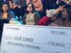 Stockton student Julie Coker, second from left, received a $100,000 check from Justin Bieber on MTV.