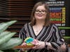 Julie Coker at Stockton University with one of the message rocks Active Minds places around campus.