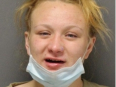 Savannah Banks spat on officers responding to a dispute at the Lacey Inn, according to police.