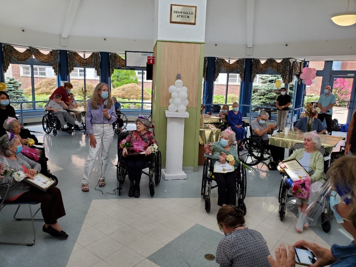 Morris County Commissioner Deputy Director Deborah Smith congratulates the birthday honorees at the Morris View Healthcare Center in Morris Township.